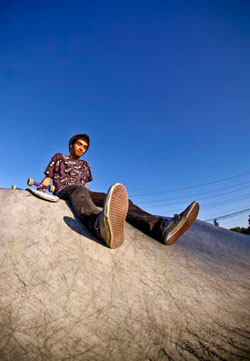 skateboarder portrait sitting at riley skate park in farmington michigan hdr